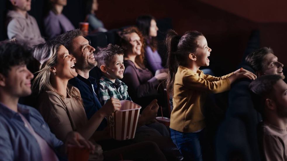 People laughing at cinema